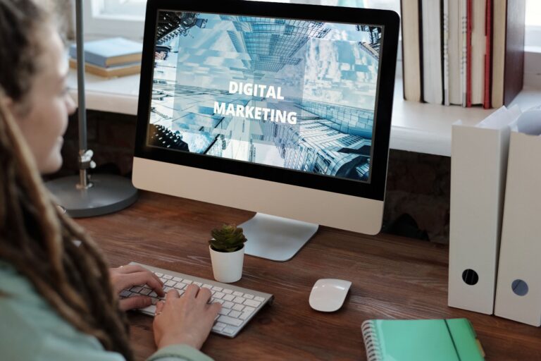 Small business owner planning digital marketing strategy on laptop