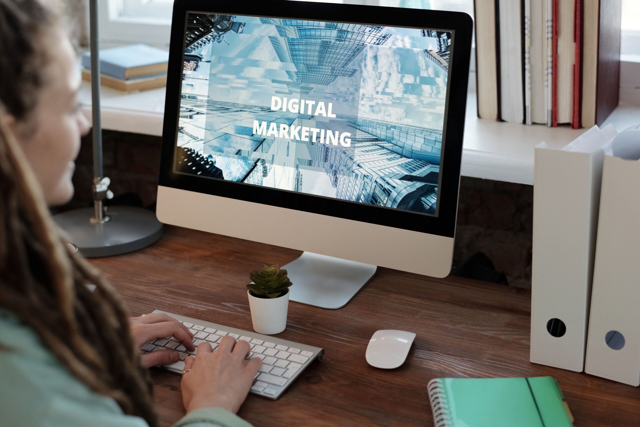 Small business owner planning digital marketing strategy on laptop